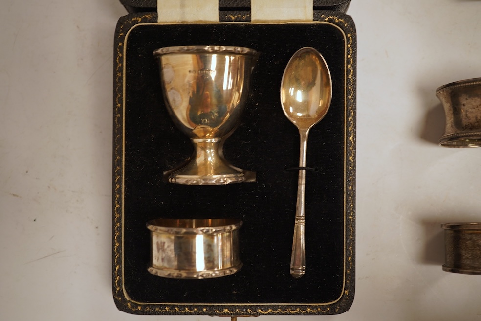 A late Victorian demi-fluted cream jug and sugar bowl, Charles Stuart Harris, London, 1888, together with cased silver christening egg cup, spoon and napkin ring and two other silver napkin rings.